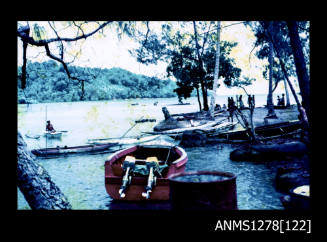 35mm colour transparency of three boats in the water, and people standing near the shoreline