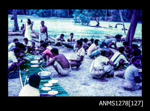 35mm colour transparency of numerous Papua New Guinean [?] people, congregating on the shoreline