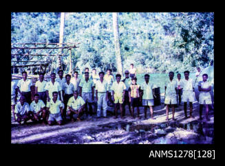 35mm colour transparency of numerous Papua New Guinean [?] people, congregated for a photograph on the shoreline