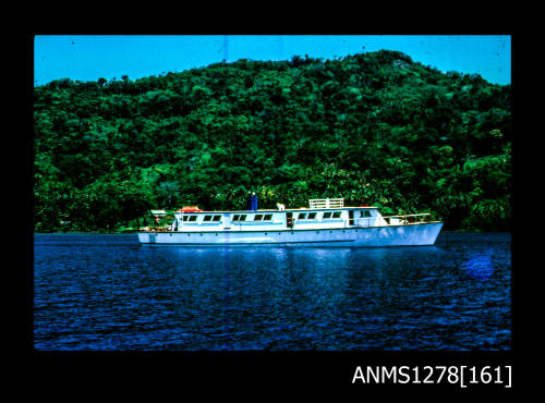 35mm colour transparency of a boat in the water, in front of land