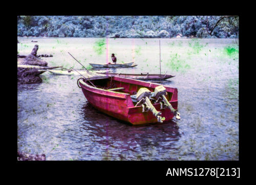 35mm colour transparency of a red boat in the water