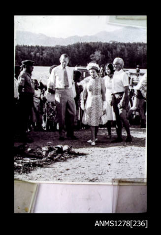 Queen Elizabeth II, Prince Philip and Denis and Yuli George inspecting pearl shells