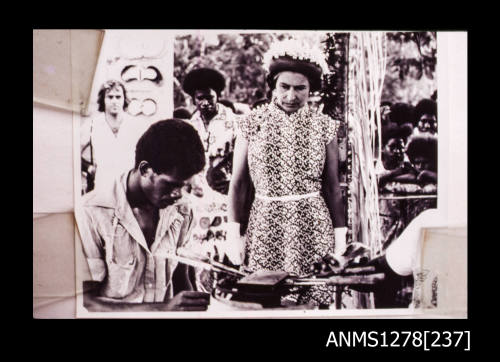 Queen Elizabeth II watching a pearl demonstration at Milne Bay