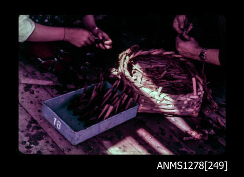 35mm colour transparency of a basket, and object sitting in a tray