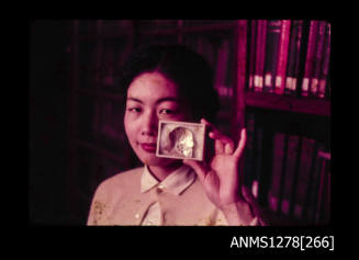 35mm colour transparency of a Japanese woman holding a small box containing a pearl shell