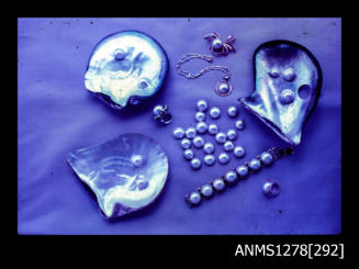 35mm colour transparency of three pearl shells with pearl blisters, half pearls (or mabe pearls) and pearl jewellery
