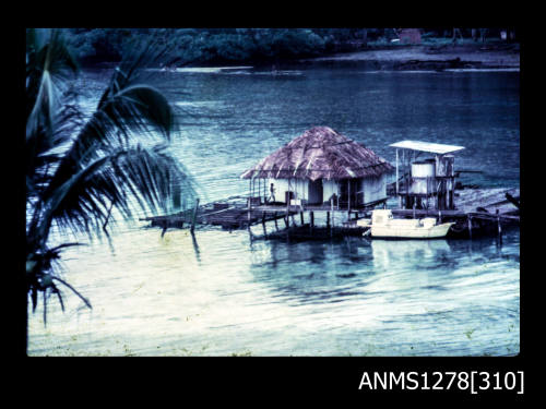 35mm colour transparency of a shed built over the water