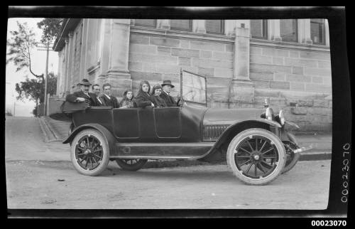 Group portrait, including Captain Edward R Sterling, in a car