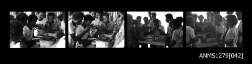 Strip of four black-and-white negatives, of a person seeding a pearl shell, with people watching