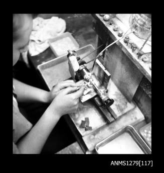 A woman using a grinding machine