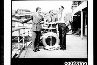 Three unidentified men on board RMS CARONIA