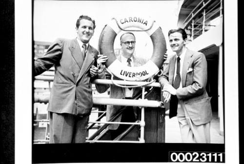 Three unidentified men on board RMS CARONIA