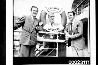 Three unidentified men on board RMS CARONIA