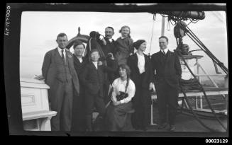 Captain Edward Robert Sterling with seven other people on a ship's deck