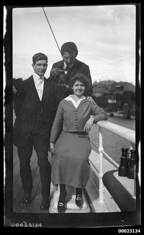 Ethel Manila Sterling and two men on a ship's deck