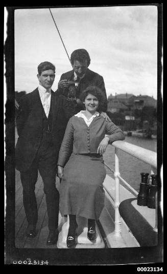 Ethel Manila Sterling and two men on a ship's deck