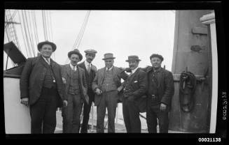 Six men, including Captain Edward Robert Sterling on a ship's deck