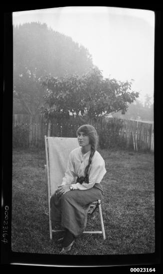 Woman seated on a lawn