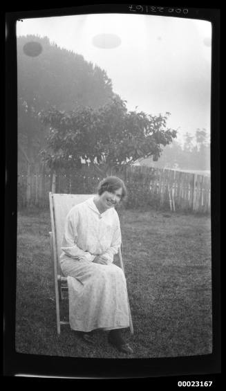 Woman seated on a lawn