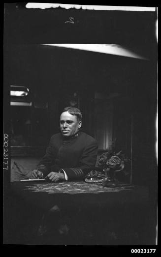 Man seated behind a desk