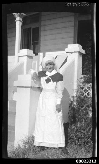 Girl standing next to steps of a house