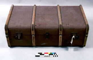 Red travelling trunk