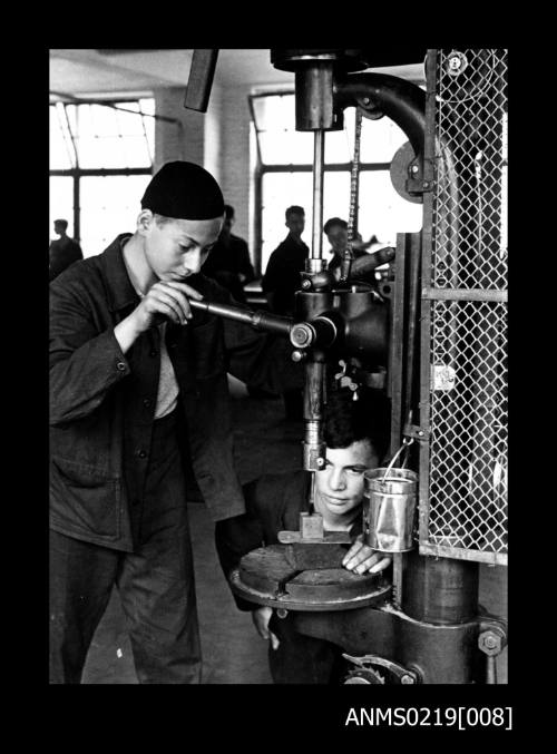 Henry Lippmann and a classmate working with a metal drill at the ORT School, Berlin