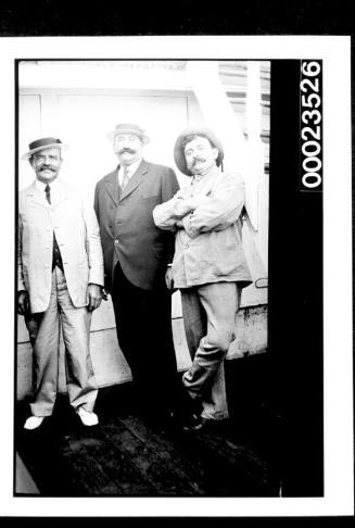 Ships and steamer crews, three men in suits