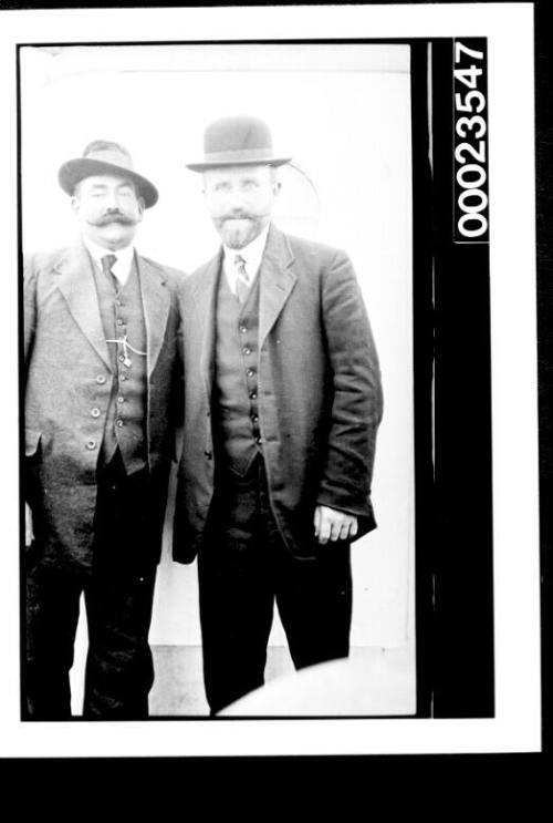 Ships and steamer crews, two men in suits