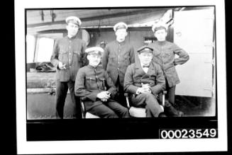 Ships and steamer crews, three men in uniform