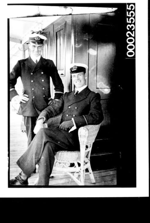 Ships and steamer crews, man on cane chair and man standing