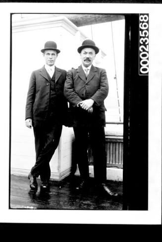Ships and steamer crews, two men in suits and bowler hats