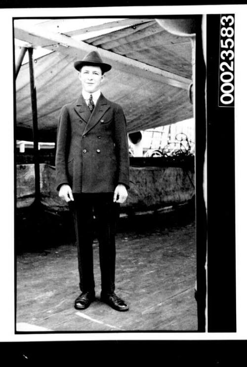 Ships and steamer crews, man in suit on deck