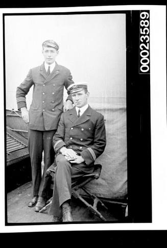 Ships and steamer crews, two officers standing