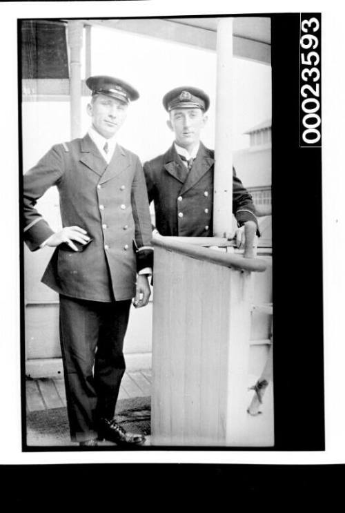 Ships and steamer crews, two men in uniform on deck