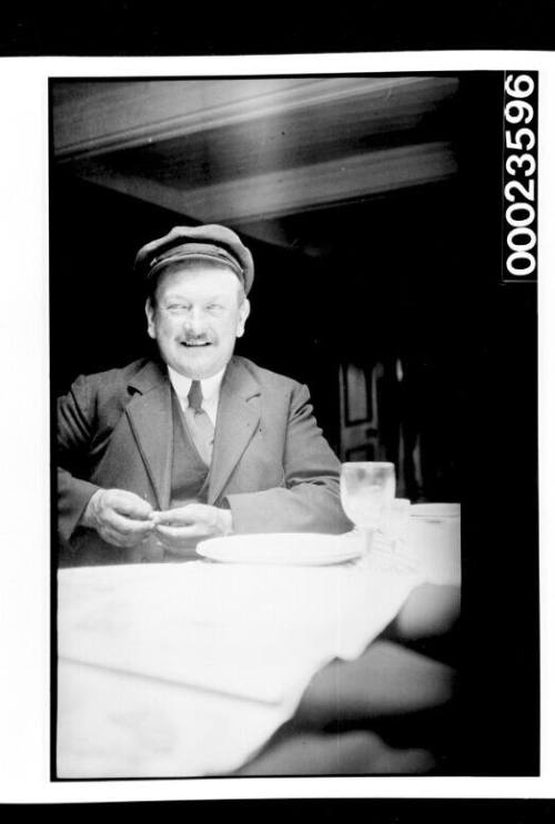 Ships and steamer crews, man seated at table