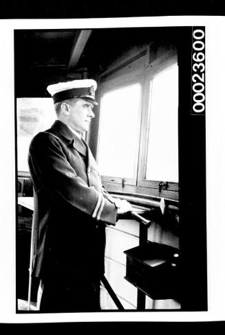 Ships and steamer crews, man in uniform standing with telescope