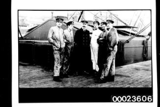 Ships and steamer crews, six men on deck, five in overalls