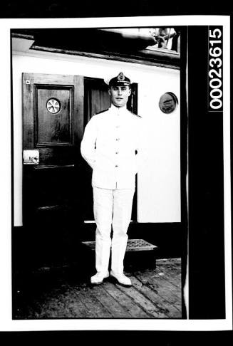 Ships and steamer crews, man in uniform standing outside open doorway