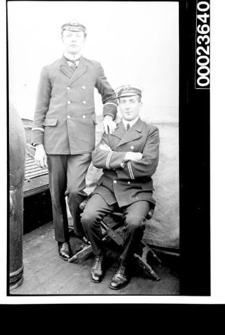 Ships and steamer crews, two men in black uniforms