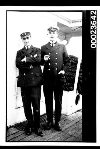 Ships and steamer crews, two men standing in uniform