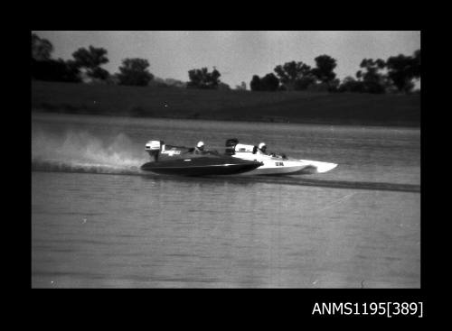 Lake Glenmaggie 1971, picklefork style outboard catamaran ELECTRA FIRE and an unidentified outboard catamaran