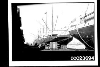 Two steamships at a wharf