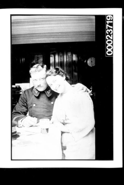 Man and woman seated at table