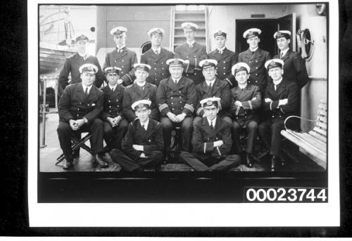 Sixteen men in naval uniform