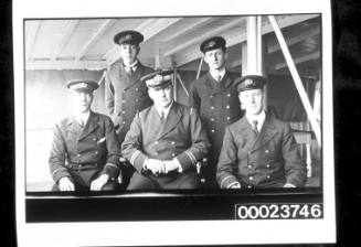 Five men in merchant uniforms