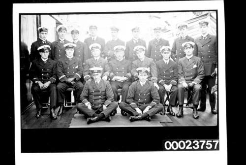 Eighteen men in naval uniform