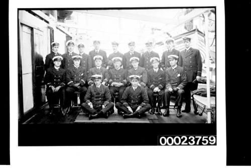 Eighteen men in naval uniform