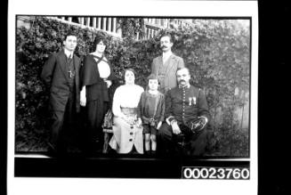 Woman, child and officer in garden