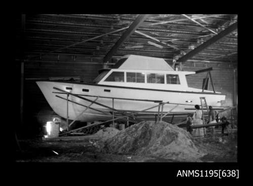 Construction of first GRP displacement vessel, a half cabin boat